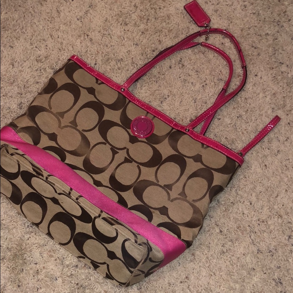 Coach logo purse with hot pink stripe